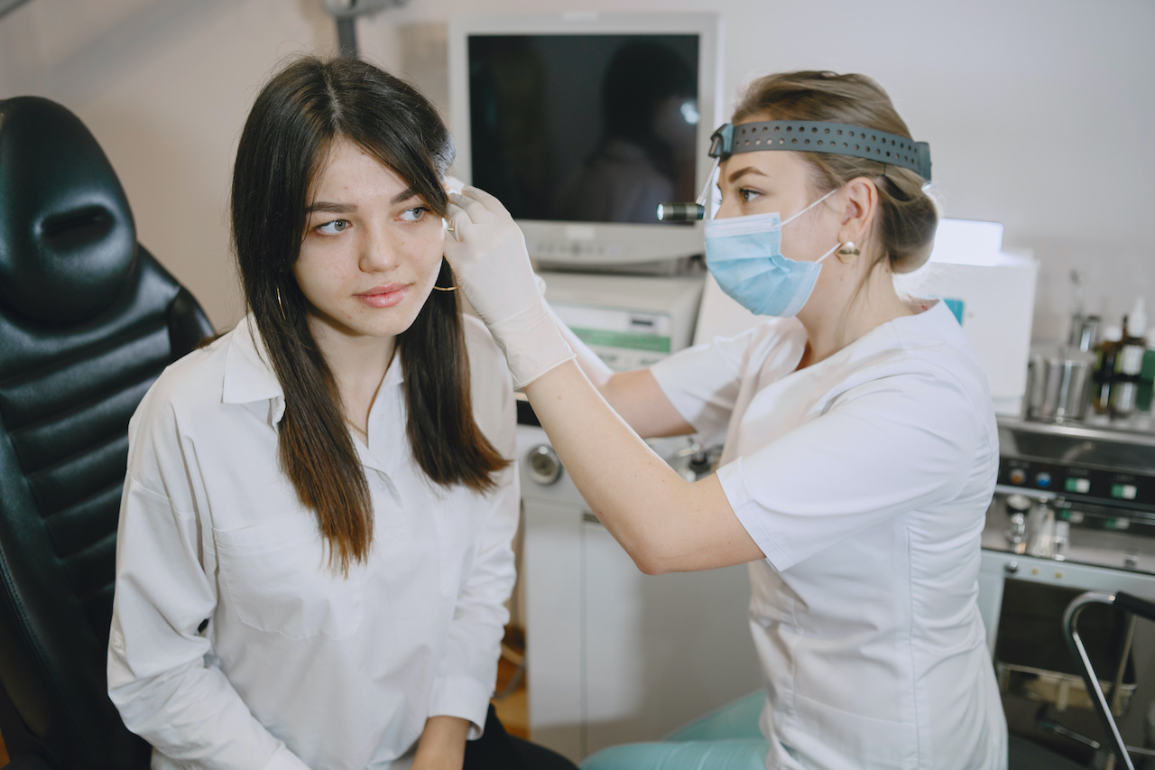 Otolaryngologist preparing for the medical examination procedure Oticon PlayPX Magic of childhood
